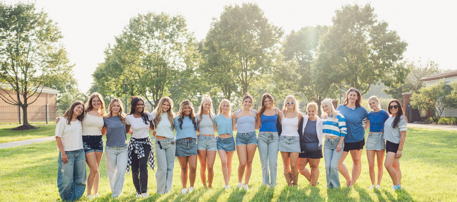 A group of women of all ages standing together while wearing Fizzy's licensed hair claws and patented word hair clips.

