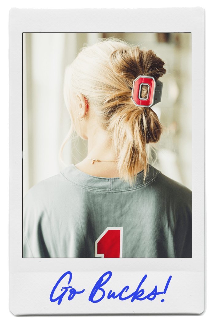 Young blonde woman wearing OSU hair clip in one of FiZZY's collegiate claw clip styles
