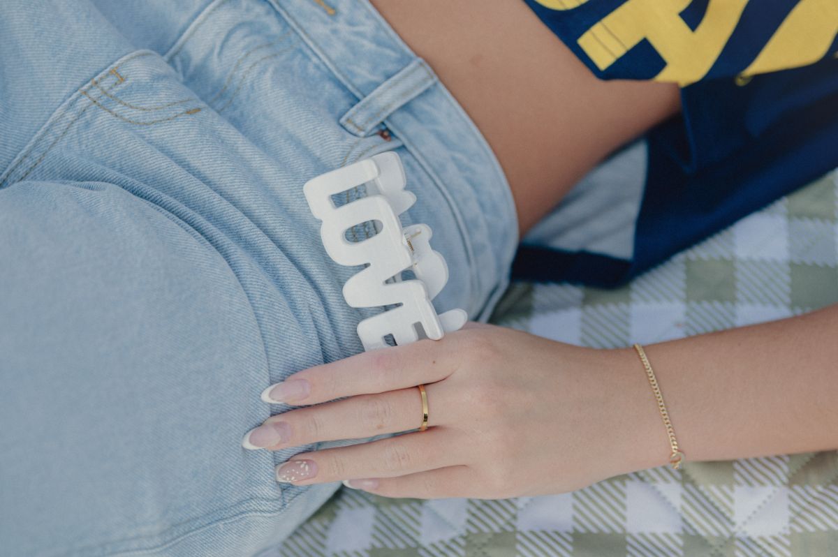 Girl with LOVE patented hair claw by FiZZY  in her jeans pocket