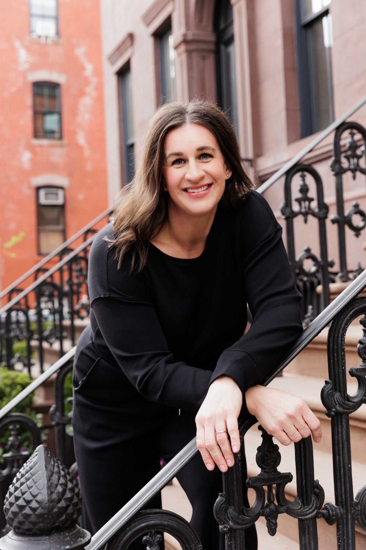 Woman founder of FiZZY, a brand offering patented hair claws for women, posing in NYC