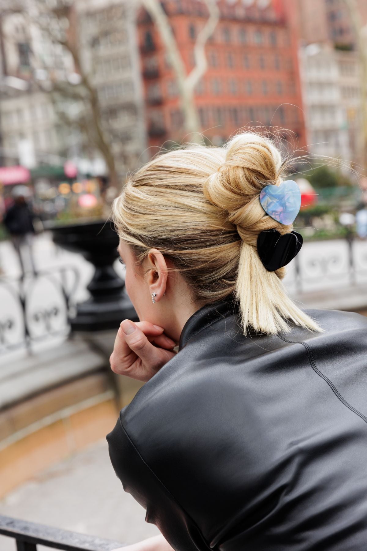 Blonde woman posing in NYV with two FiZZY heart shaped hair claws