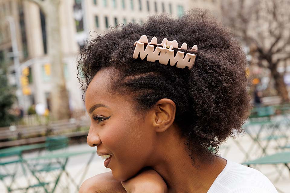 Young woman wearing MAMA word hair claw clip by FiZZY